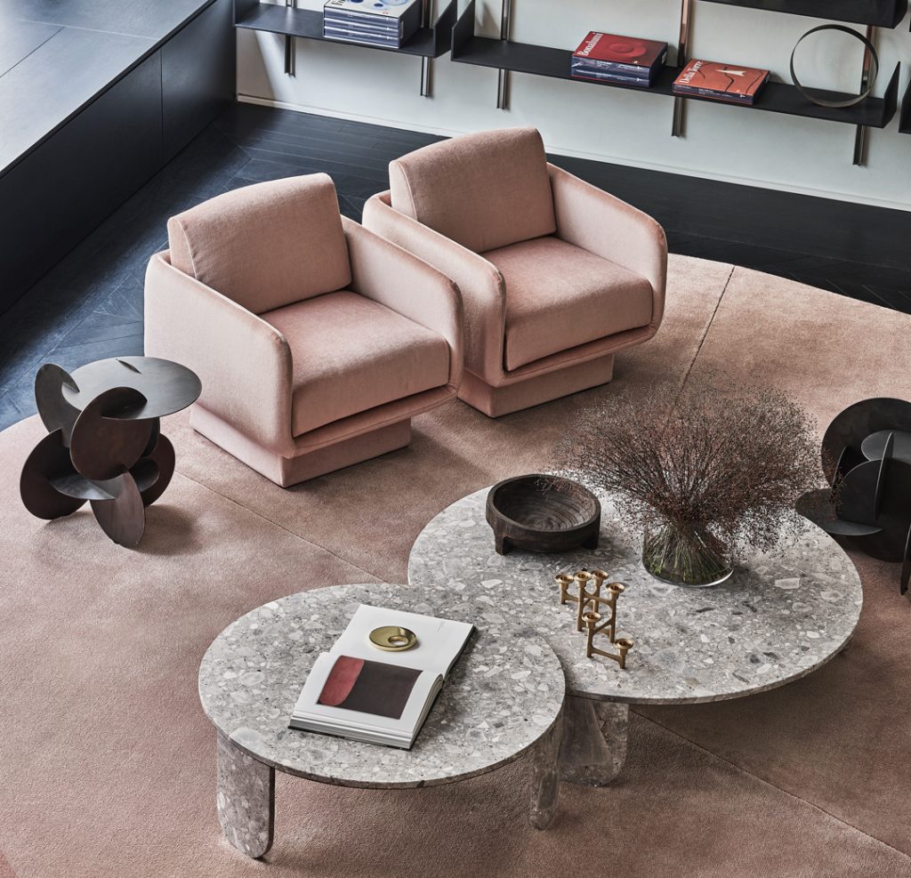 Pair of Lilas chairs in pink on a pink rug with a Clemo marble table in front of them