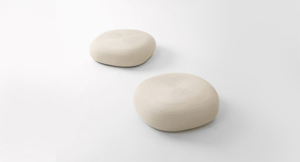 Two Otto Pouf two thousand twenty one in cream color in front of a white background