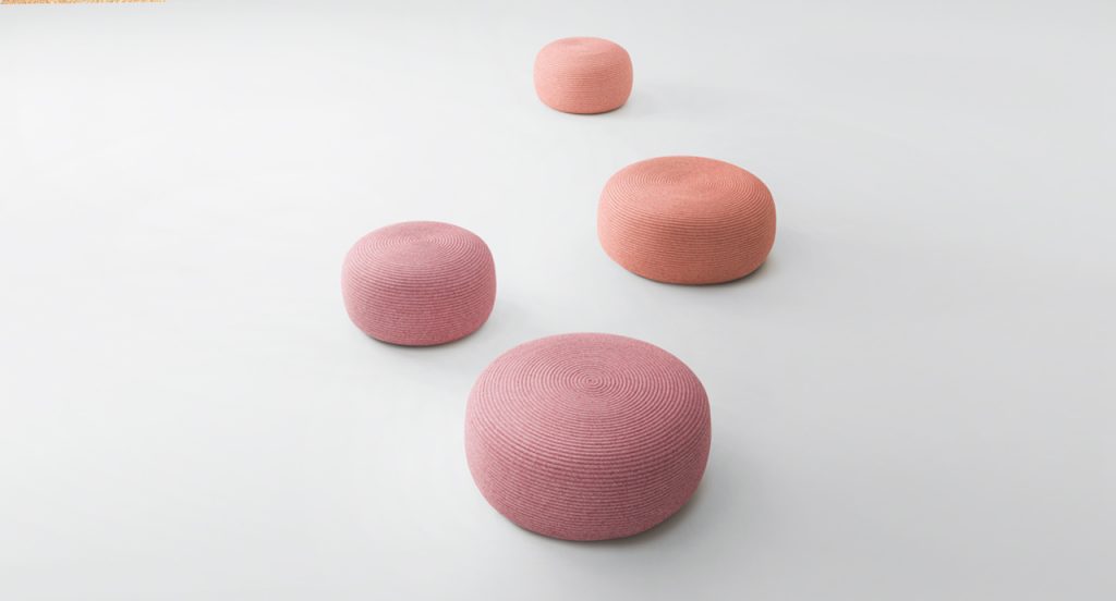 Four Otto Pouf two thousand twenty one, two in a pink color and two in a magenta color in front of a white background