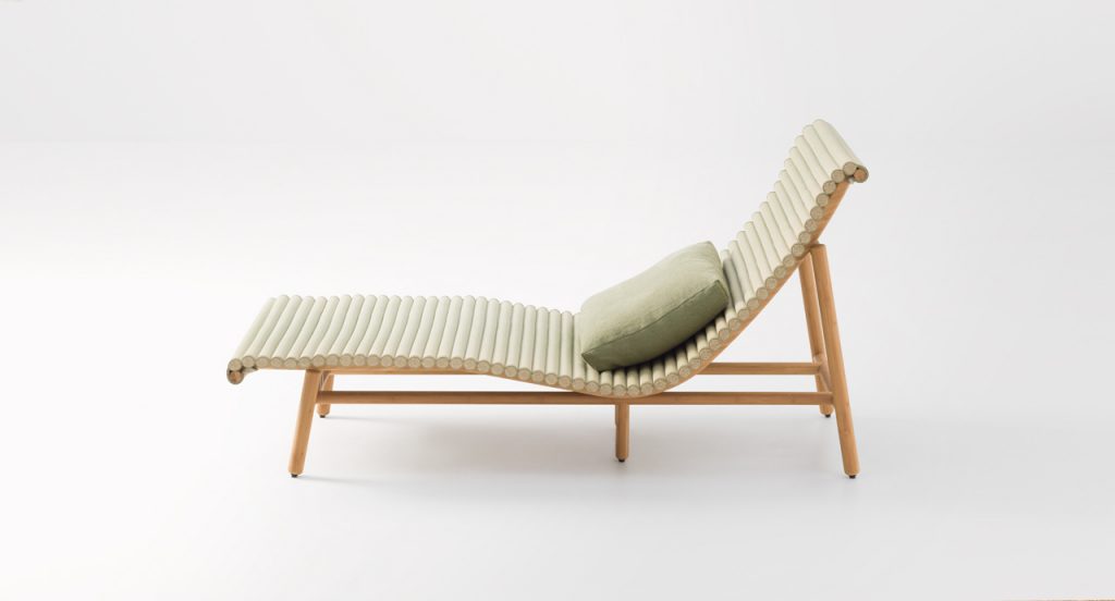 Side view of Shibusa Chaise Longue in front of a white background