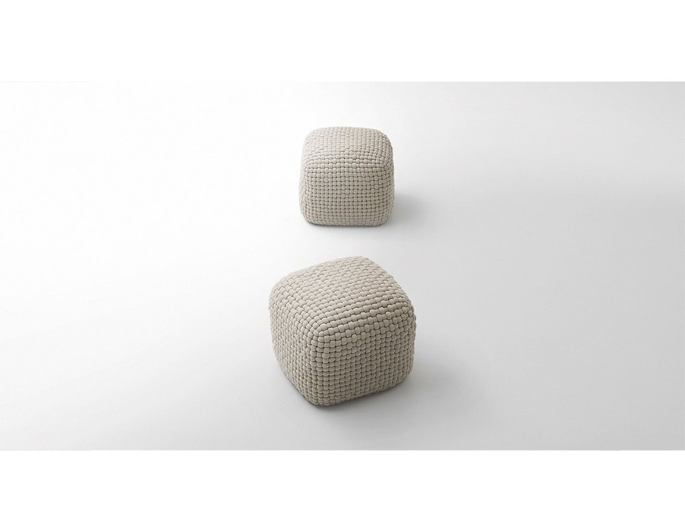 Set of beige ottomans with rounded corners, each showcasing a tactile woven design and cushioned structure.