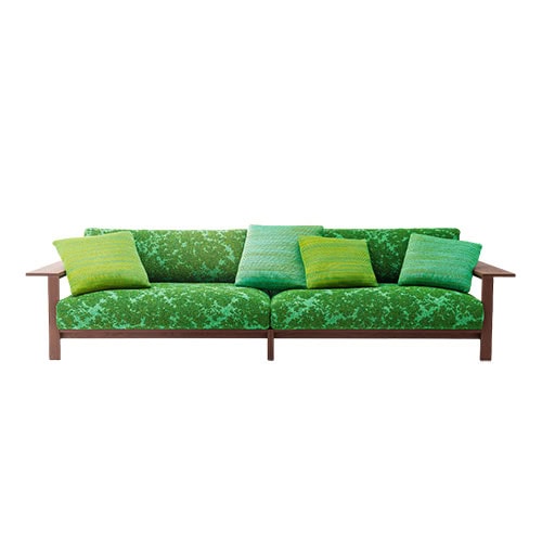 A contemporary outdoor sofa with a warm wooden frame and vibrant green patterned upholstery, complemented by soft gradient cushions in green tones for a fresh and inviting look.
