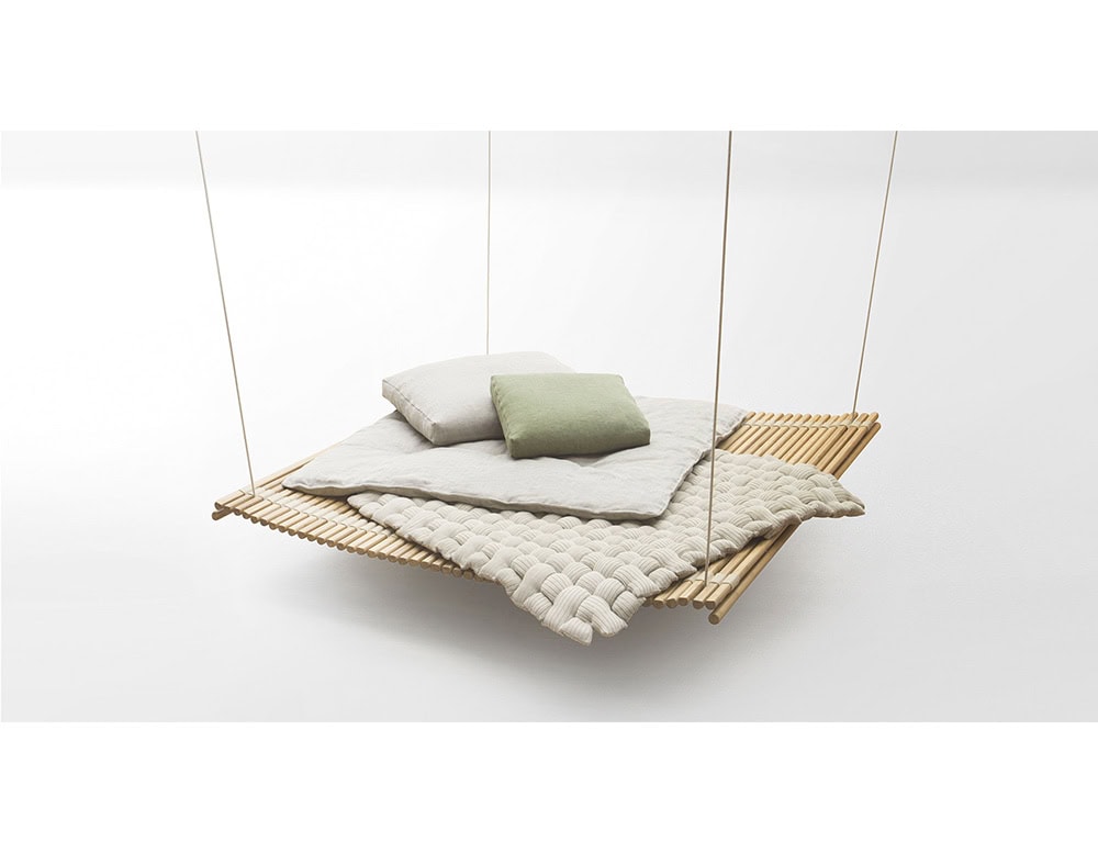 Minimalist hanging daybed in natural wood, styled with plush cushions and a woven throw that adds warmth and a serene, inviting atmosphere.