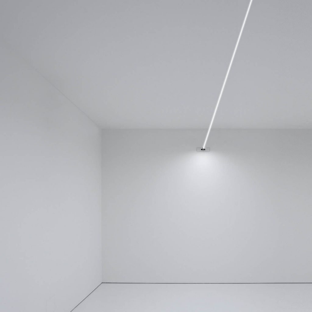Flash light illuminating the ground of a white room