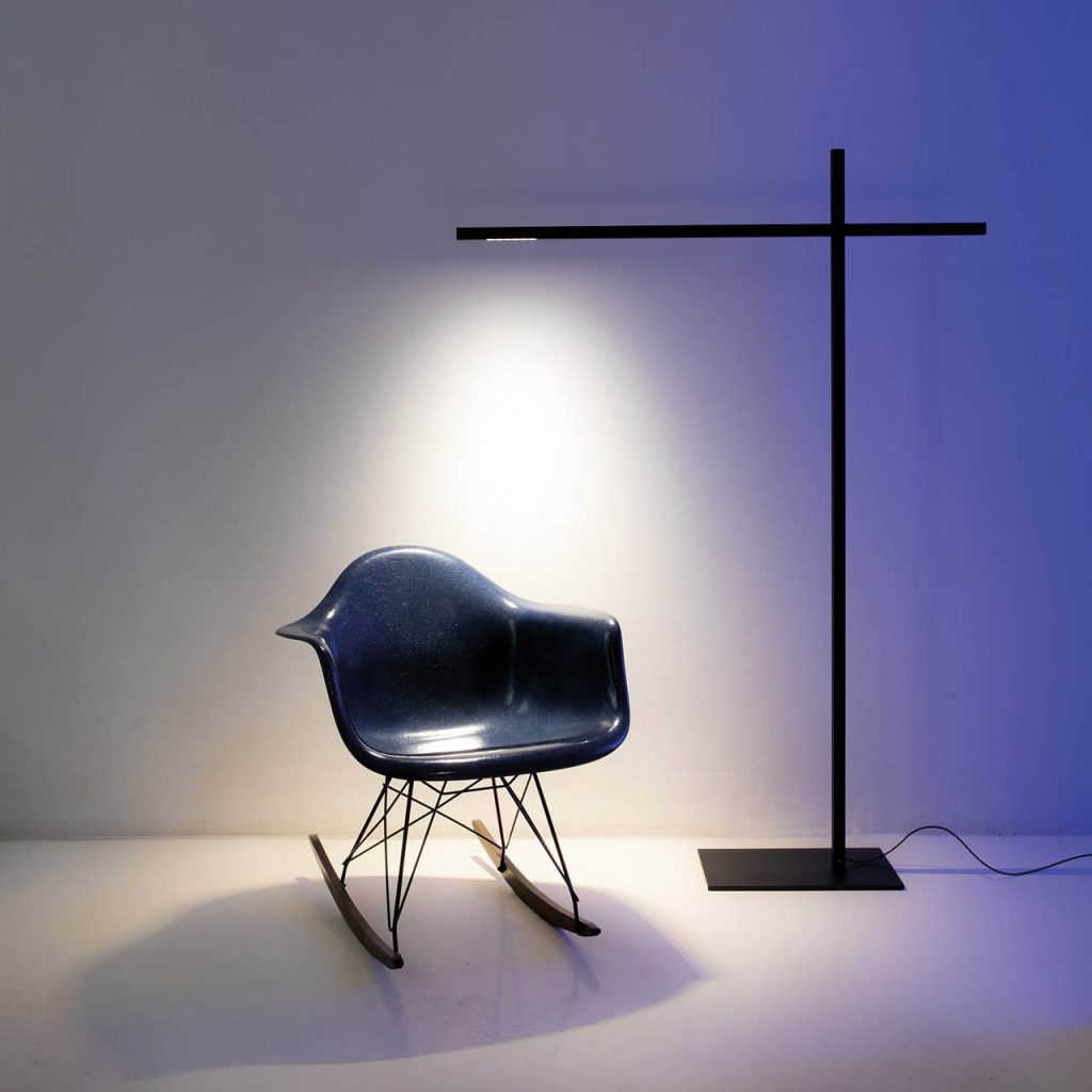 Hashi floor lamp illuminating a blue rocking chair
