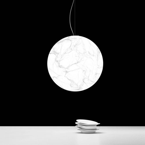 Moon light illuminating over a white table in front of a black background