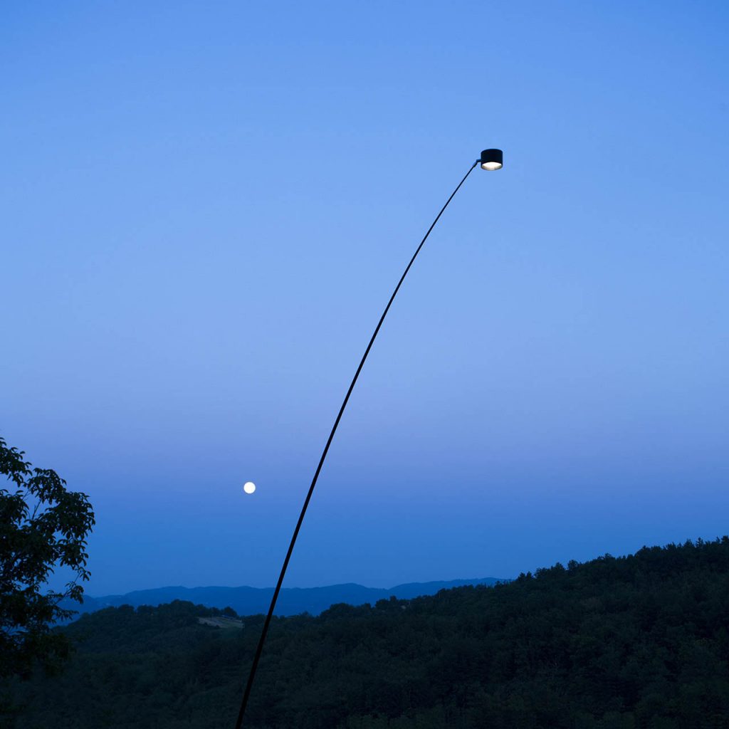 Sampei Outdoor outside at a sunset time with the moon showing in the background