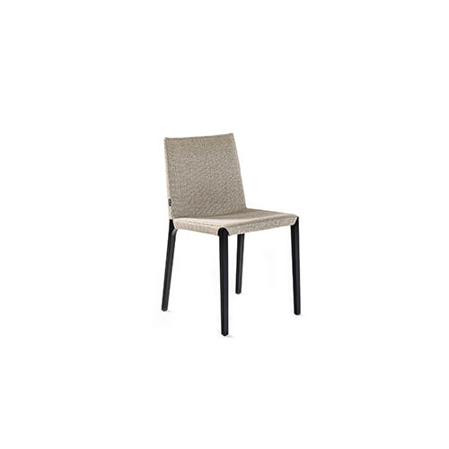Angled view of Ada dining chair in front of a white background