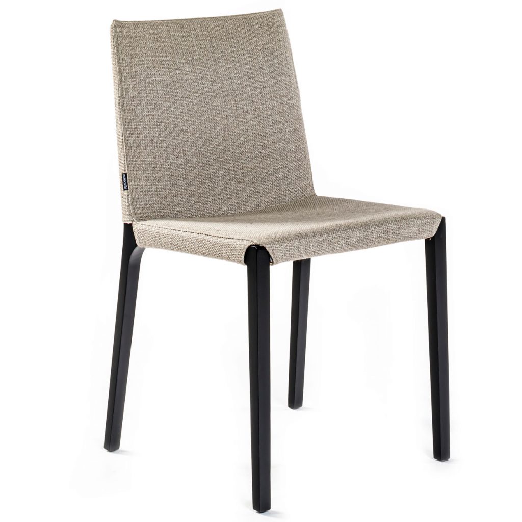 Angled view of Ada dining chair in front of a white background