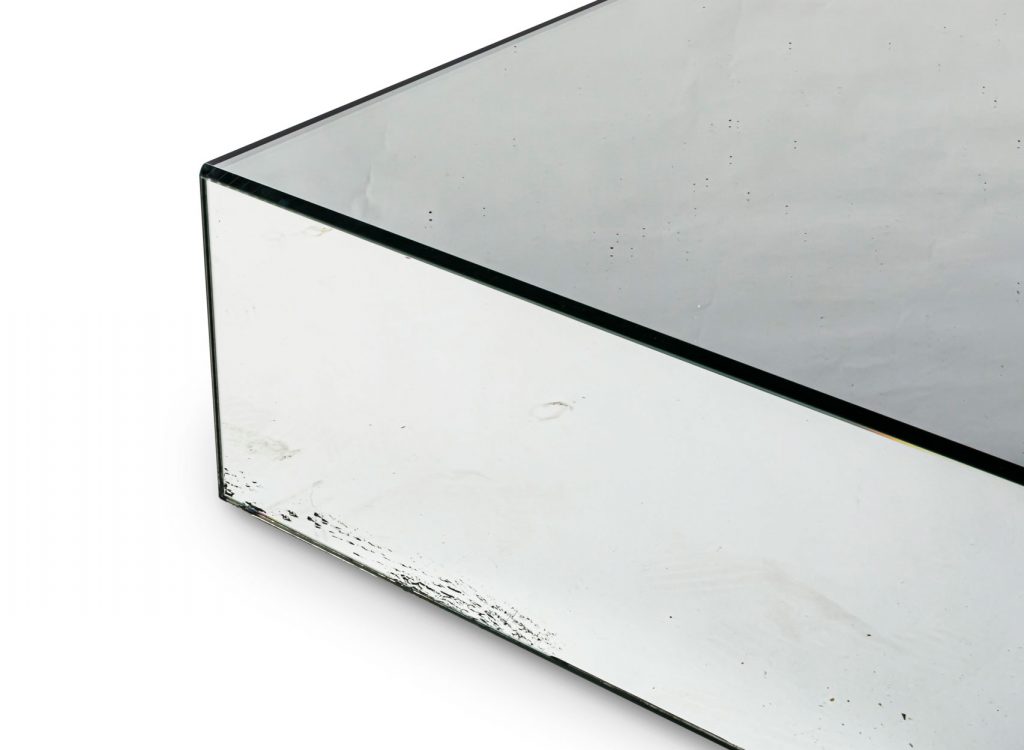 Close up edge of I Massi with a smoky top glass in front of a white background