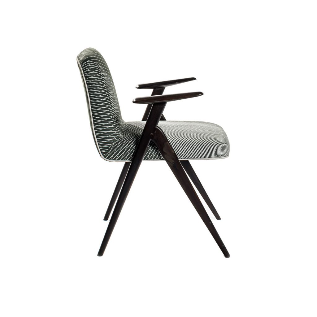 Side view of Unique chair in front of a white background