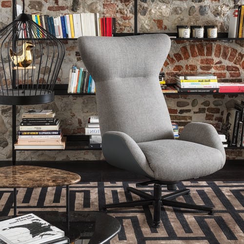 Grey colored Soho chair on top of a maze patterned rug