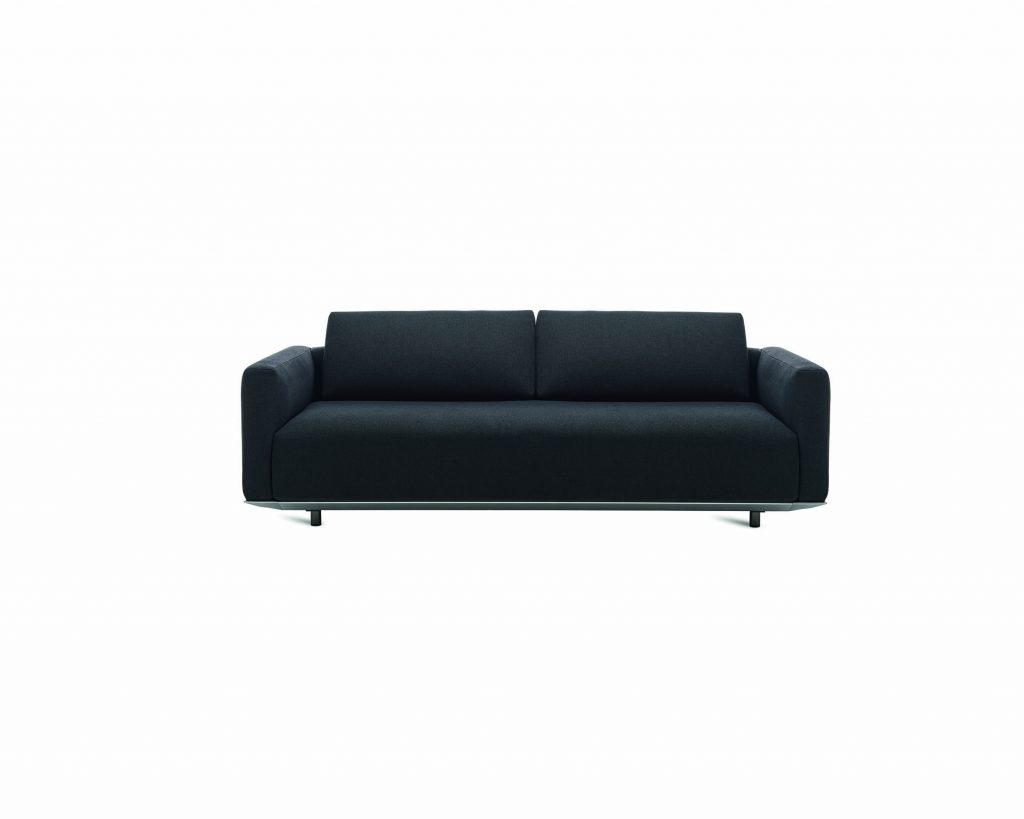 Dark colored Billie with narrow tall armrests in front of a white colored background