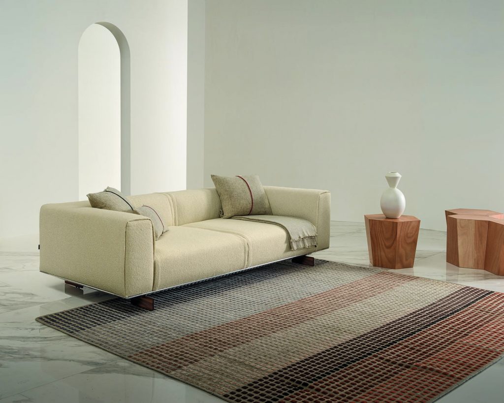 Hexagon in wood finish next to white couch