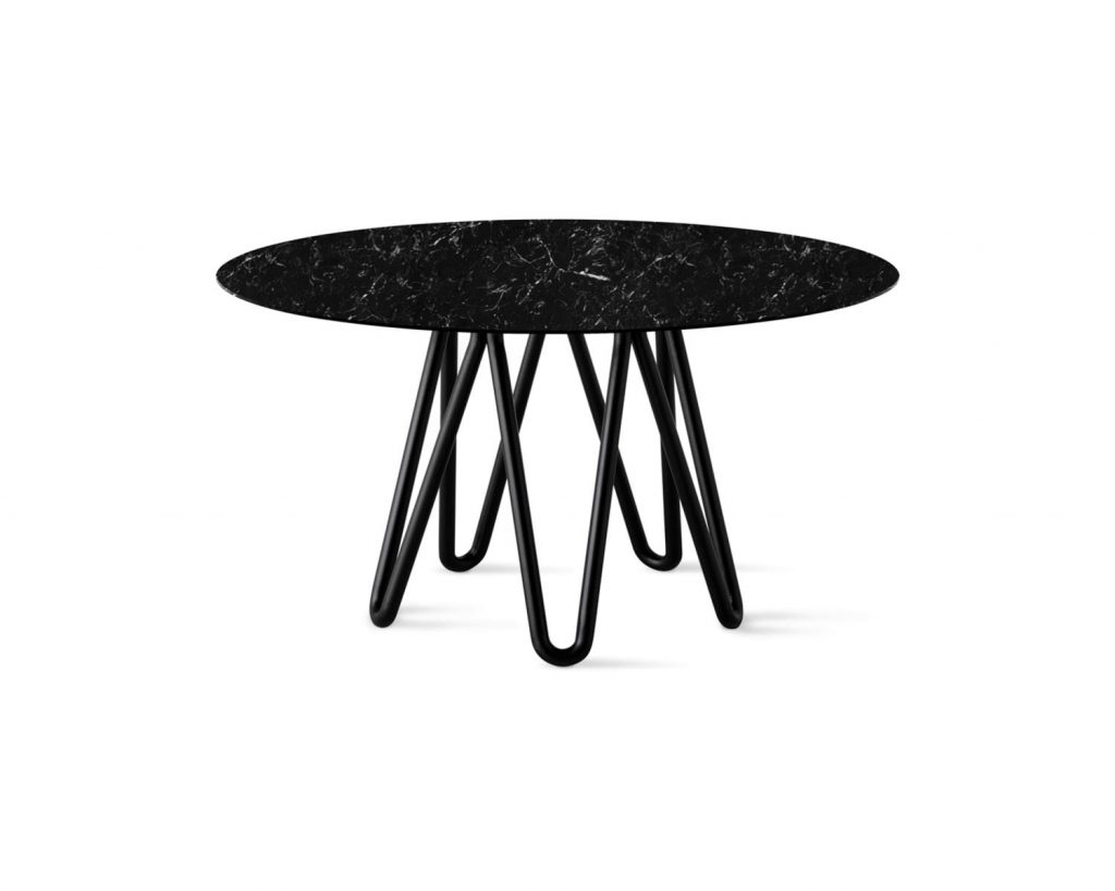 Meduse in black with a black marble in front of a white background