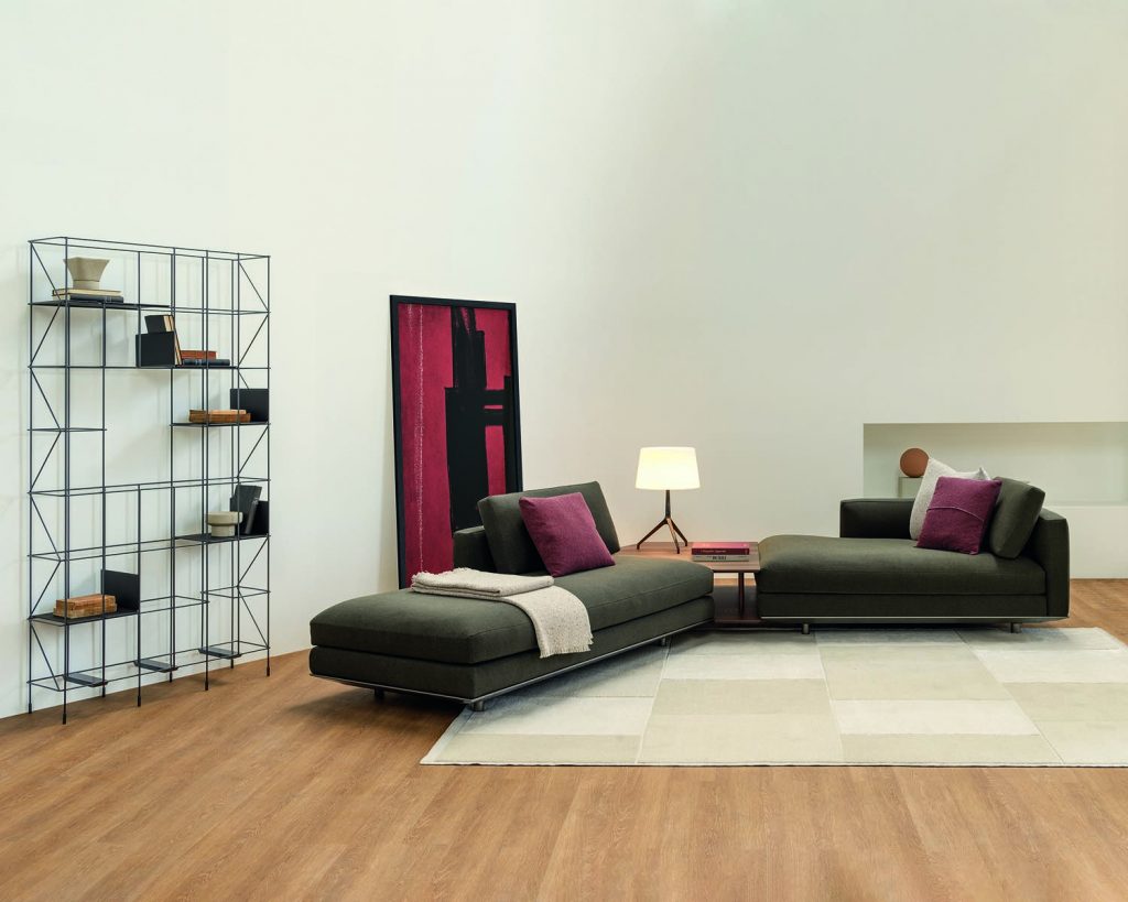 Dark colored Miles sofa on a light wood floor and white colored wall