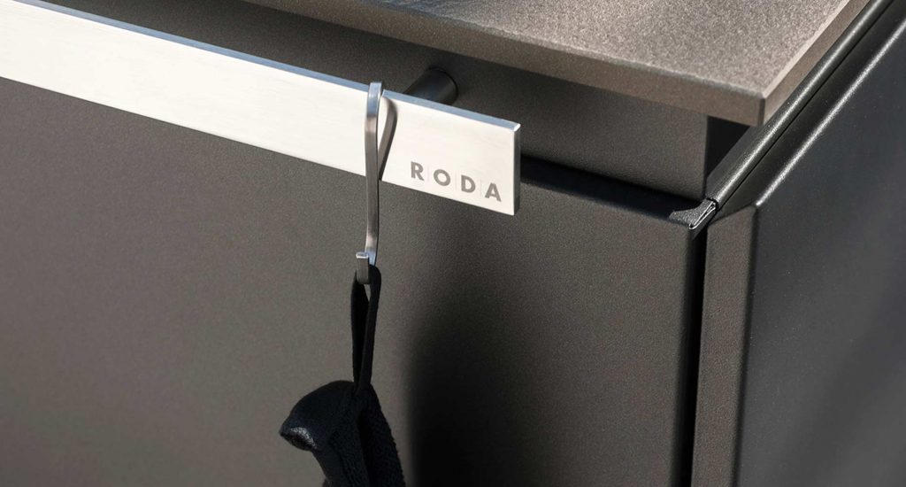 A close up of the metal handle of the Norma Two Sink that reads RODA on it