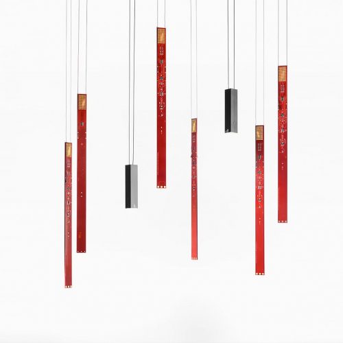A group of red and black Flying Flames hanging from a ceiling in front of a white background