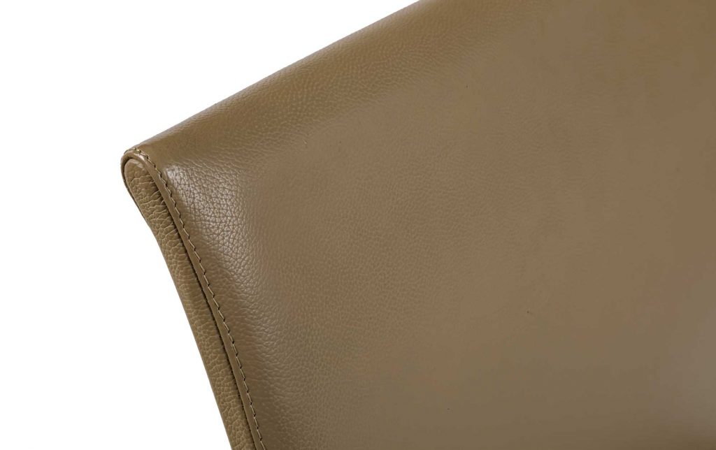 Close-up of Mirta backrest in front of a white background