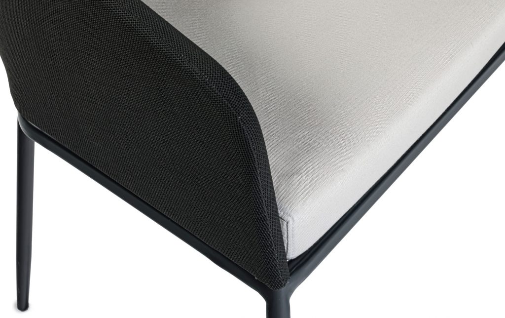 Close-up of Senso bottom cushion and arm rest in front of a white background