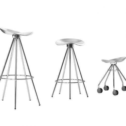 Three variations of the Jamaica Stool in polished metal: a tall bar stool, a lower counter stool, and a mobile version with wheels. Each features a sculpted aluminum seat and sleek, flared-leg base for ergonomic comfort and industrial style.