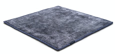 Hand-woven and braided rug in a tone of sea blue and white lines
