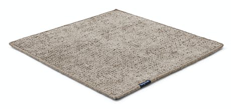 Handmade rug made of fine wool and fabrics in a gray tone on a white background