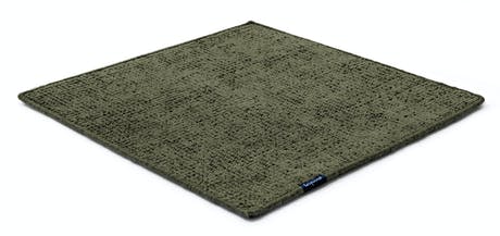 Handmade rug made of fine wool and fabrics in a dark green tone on a white background