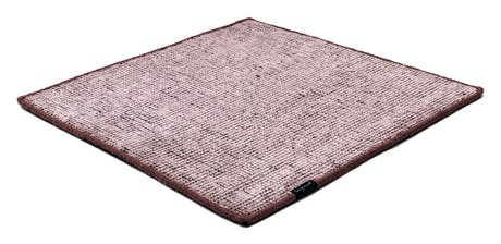 Handmade rug made of fine wool and fabrics in a pink tone on a white background