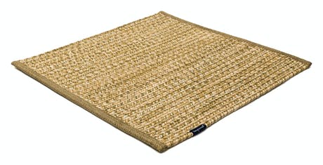 rugs made of hand-woven and braided fabric in a yellow tone