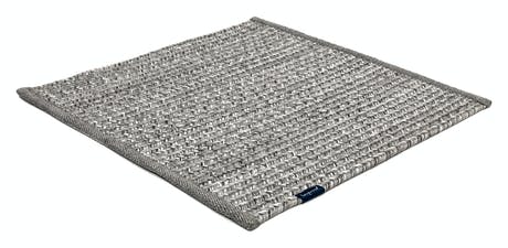 rugs made of hand-woven and braided fabric in a gray tone