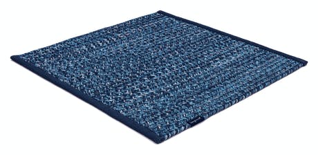 rugs made of hand-woven and braided fabric in a dark blue tone