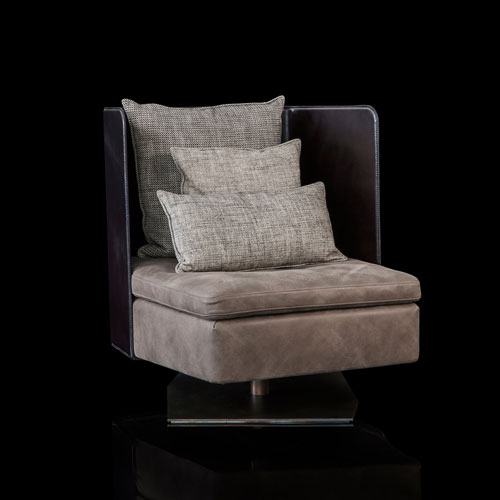Human Armchair upholstered in brown leather and three gray cushions. Structure armchair with metal base frame and central leg on a black background.