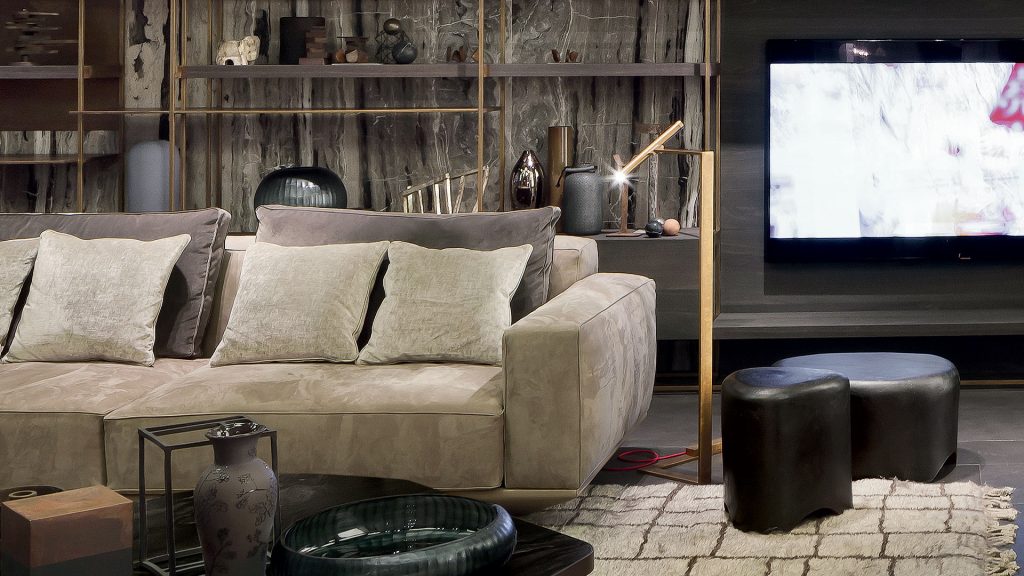 Two Pebble Tables made from black stoneware with triangle like shape in a living room.