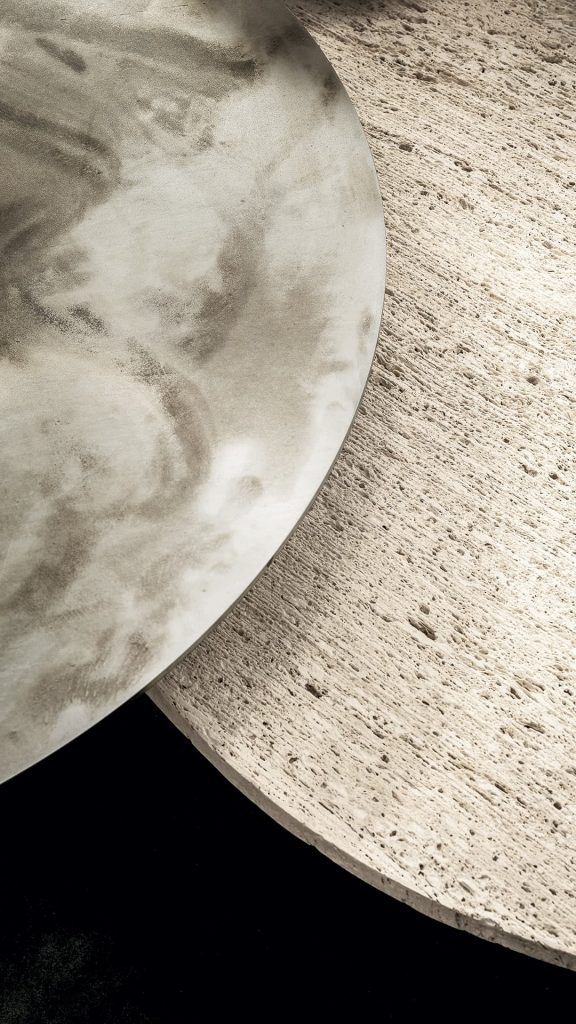 Two round Primitive Tables top in white ostuni stone on a black background.