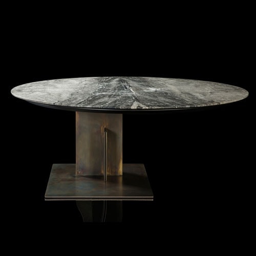 Round Shift Table Lounge. Central leg burnished black steel, top in gray and black marble on a black background.