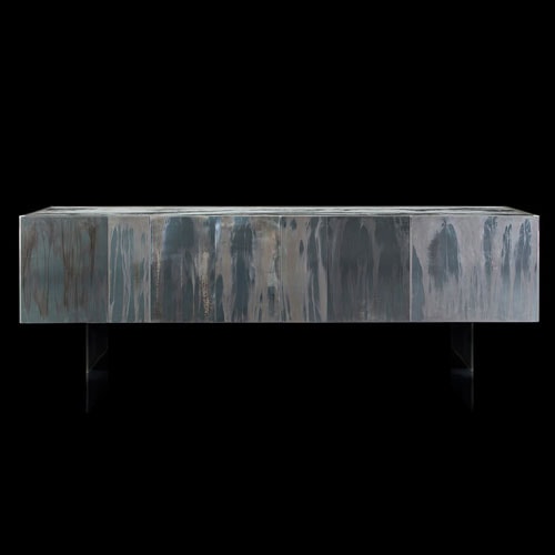 Side X Evo table, structure in natural wood covered with silver metal and top in brown and white marble pattern stone on a black background.