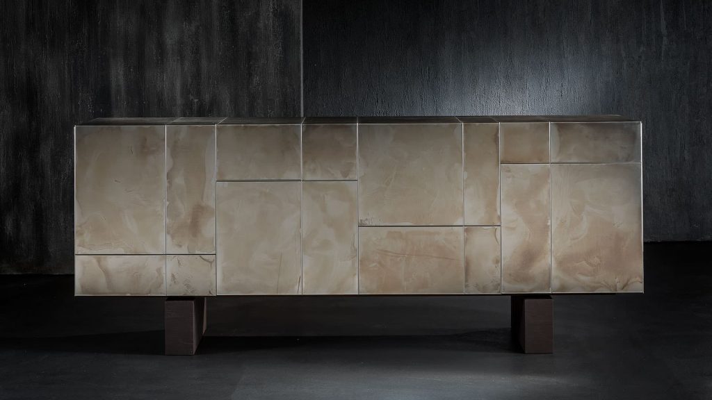 Slim Side High sideboard. Structure, base and four doors, finish in titanio on a black background.