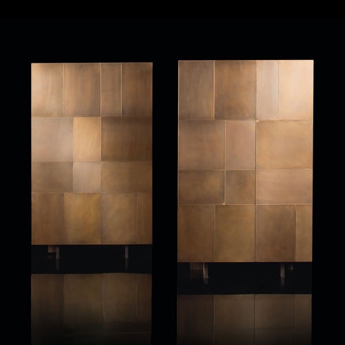 Two Slim Sides Vertical, finish and two legs in brass with a pattern of squares and rectangles on a black background.