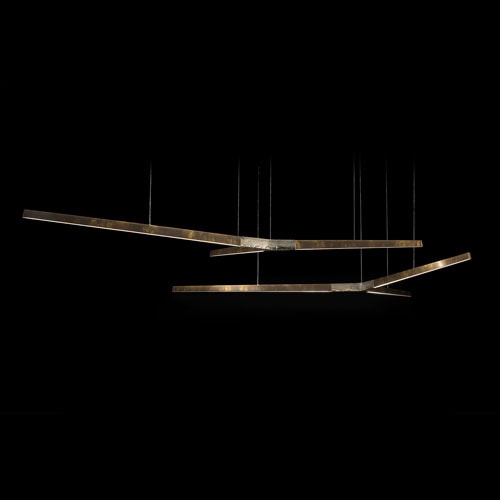 Two Starlight Horizontal led lamps with with Y shaped central body in sandcasting brass using suspension cables on a black background.