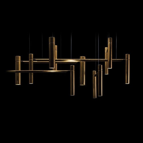 Tubular Horizontal light. Cylindrical shape with a brass finish. Leds pointing up and down joined by brass rods and suspended ropes on a black background.