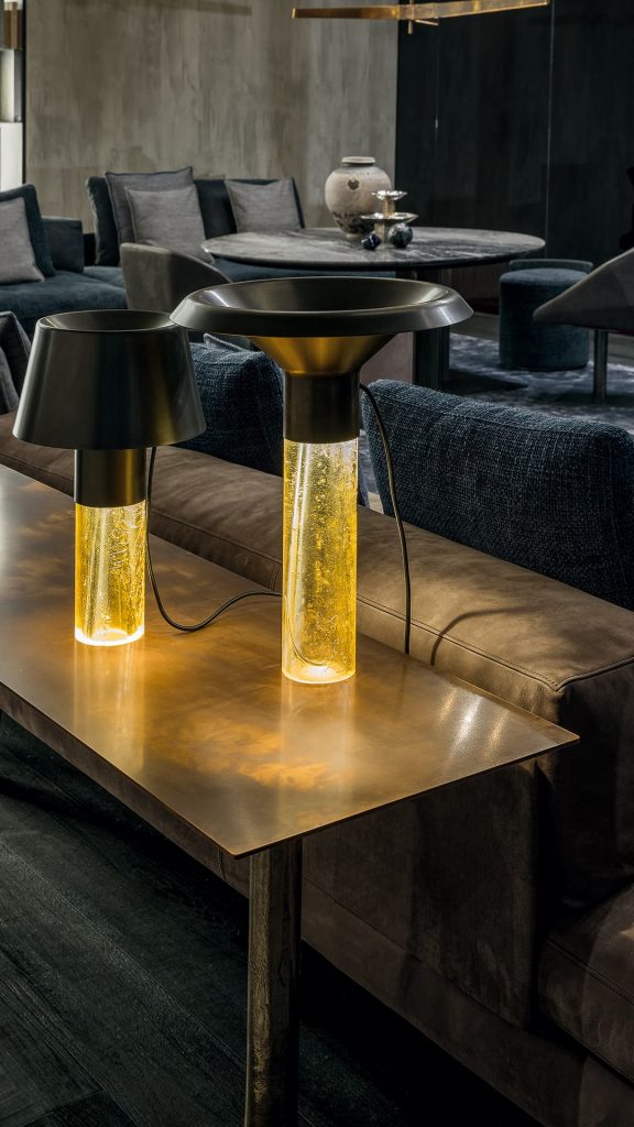Rectangle Twistable Coffe Table And Consolle. Structure support in bronze, top in bronze metal and central leg in burnished titanio in a living room.