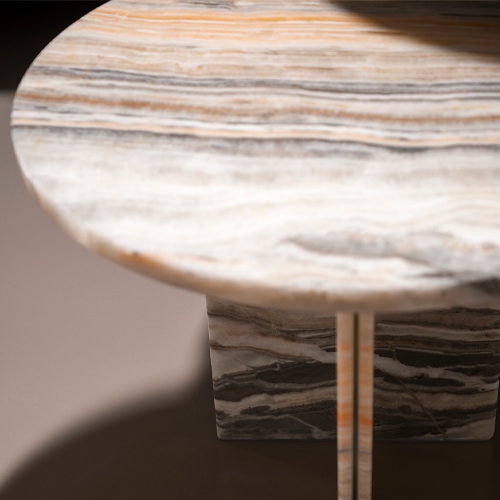 small table in gradient brass-colored marble