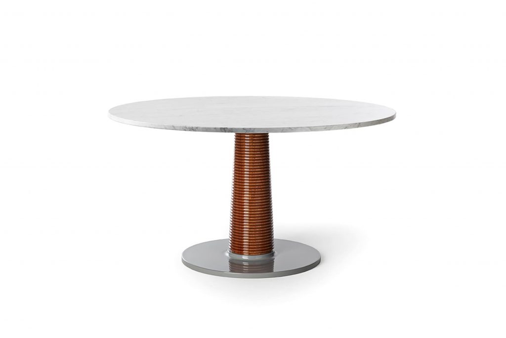 table with brass base and wooden body on a white background