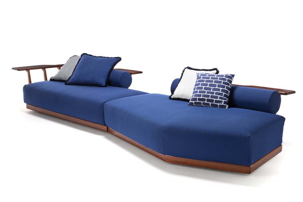 blue sofa with armrests and functional backrest on a white background