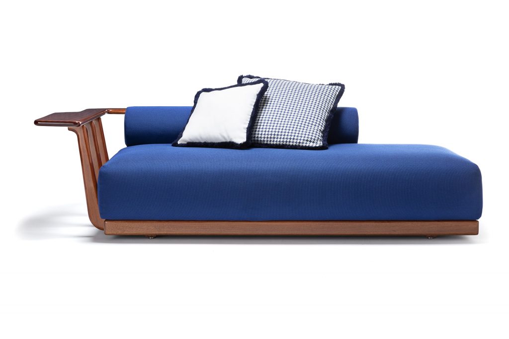 blue sofa with functional wooden backrest on a white background