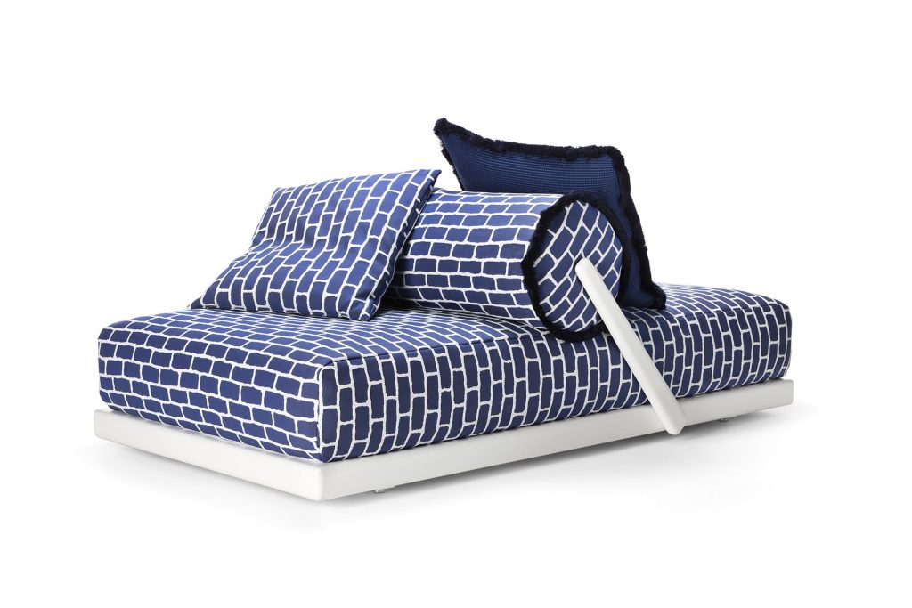 bed for two with blue and white brick finishes on a white background