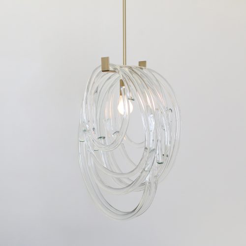 Sculptural pendant featuring solid loops of handblown glass a white background.