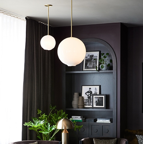 white and gold hanging spherical lamps.