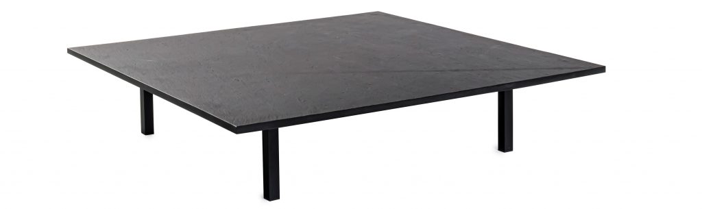 Handcrafted coffee table with matte black lacquer on a white background.